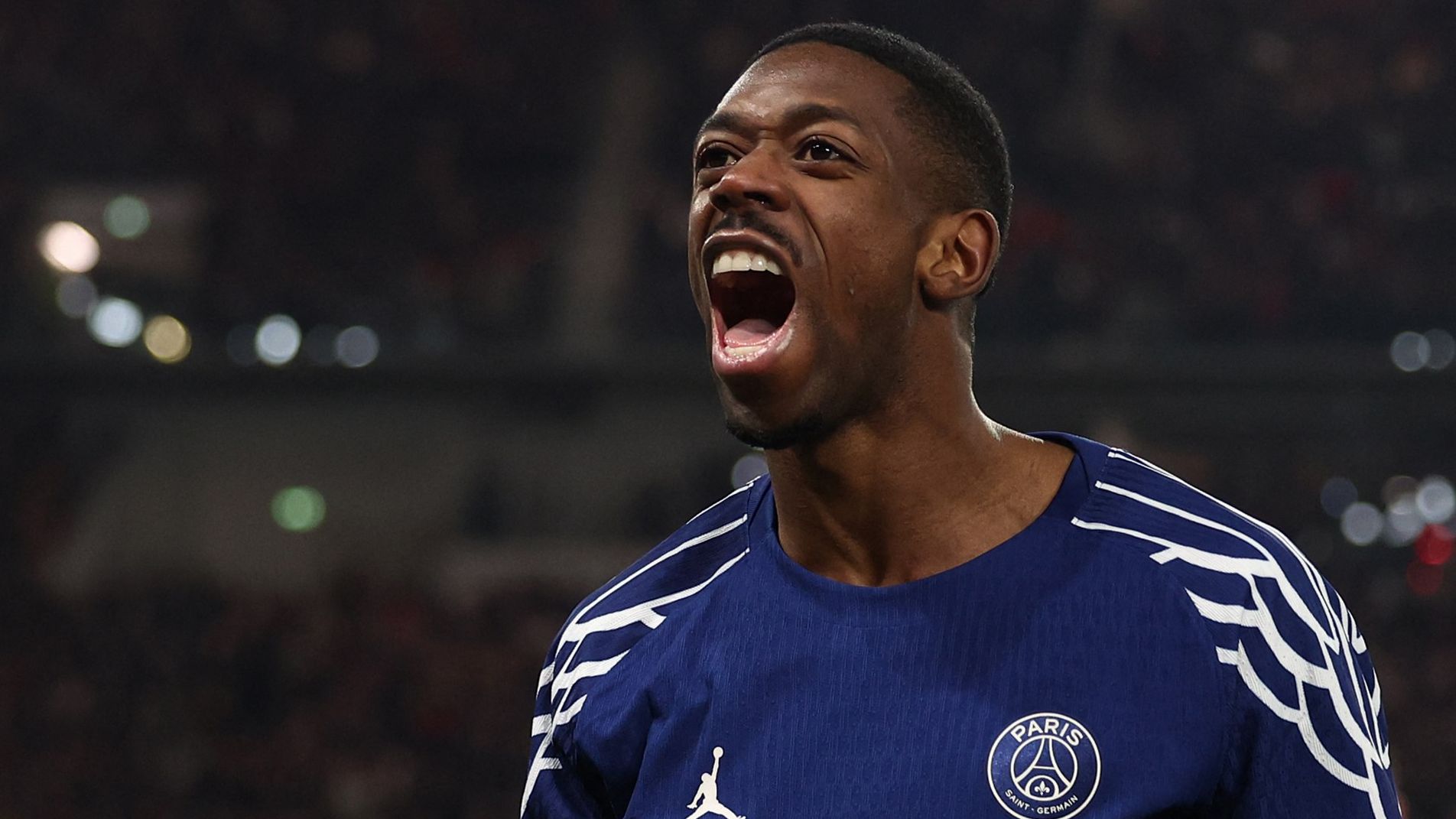 Ousmane Dembele celebrating in the Paris Saint-Germain home jersey
