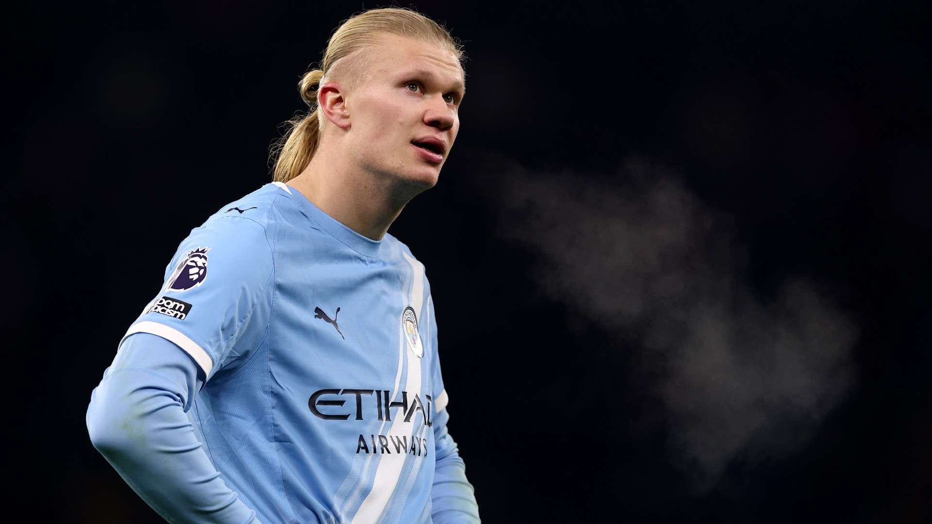 Young fan wearing the Haaland Manchester City home jersey