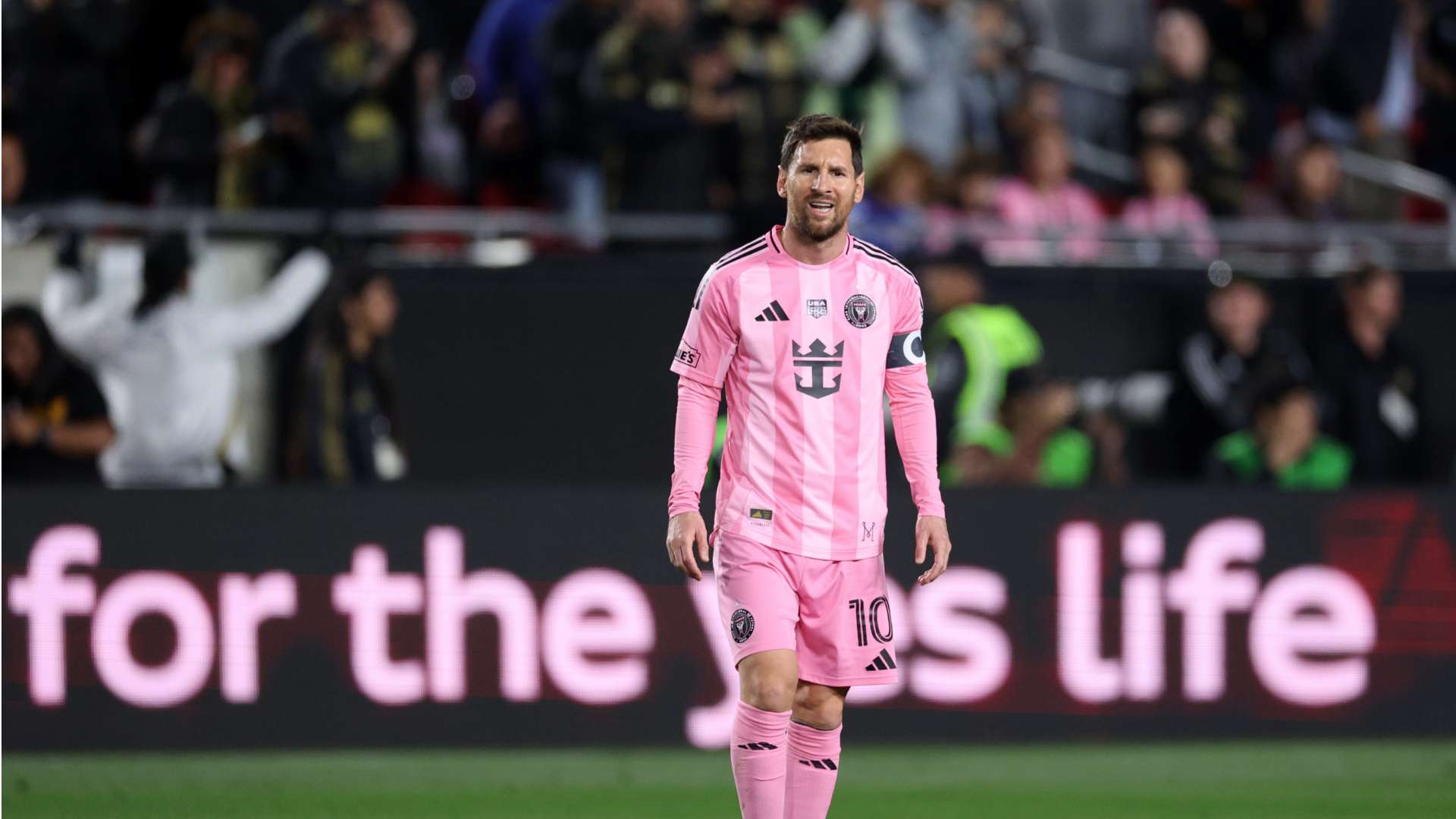 Young fan wearing the Inter Miami Messi jersey in pink and black