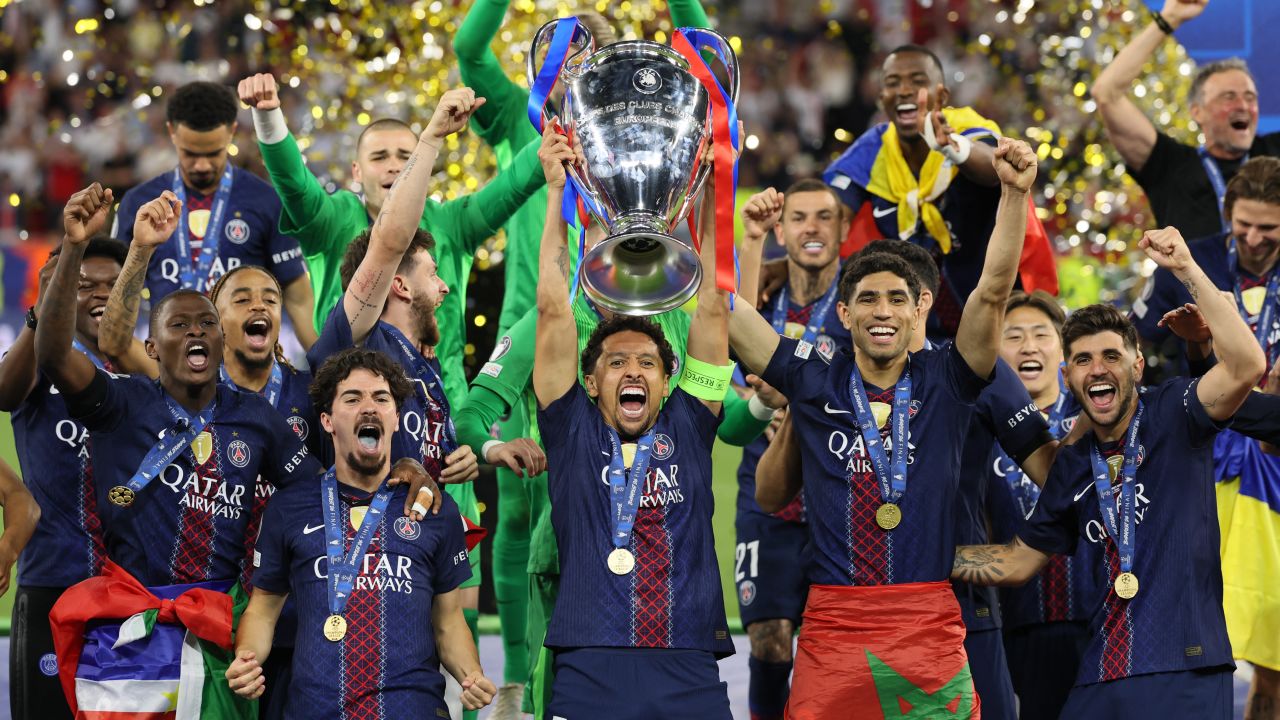 Paris Saint-Germain lift the Champions League trophy after beating Arsenal on penalties in the 2026 final