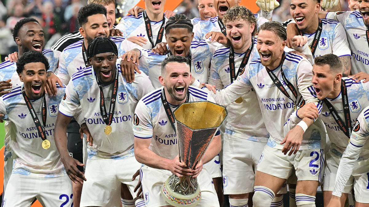 John McGinn lifts the UEFA Europa League trophy as Aston Villa celebrate their 3-0 final win over SC Freiburg in Istanbul