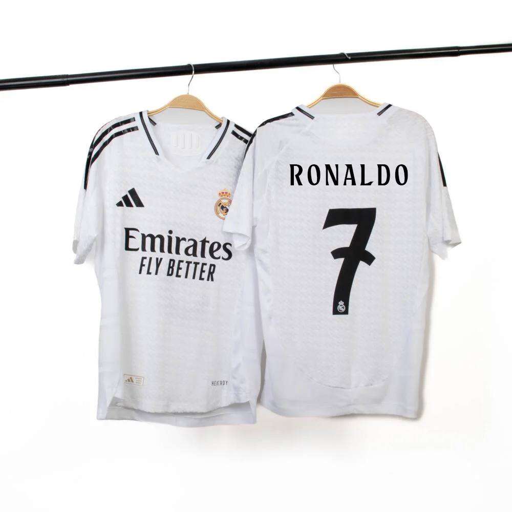 Real Madrid players in the iconic all-white Adidas kit at the Santiago Bernabeu