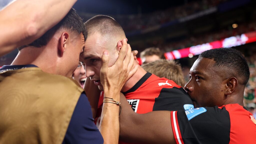 Austria's Sasa Kalajdzic is congratulated by team-mates after his stoppage-time equaliser secured a 3-3 draw with Algeria at the 2026 World Cup.