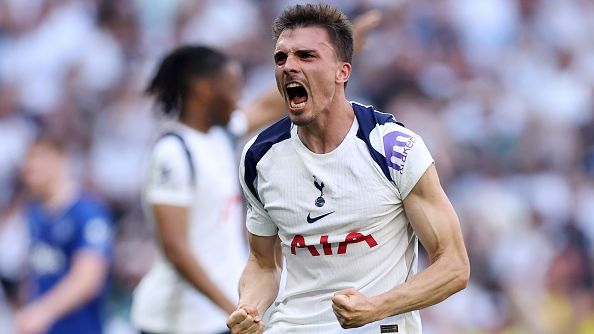 Tottenham player celebrates passionately on pitch, fists clenched, mouth open — Tottenham vs Everton
