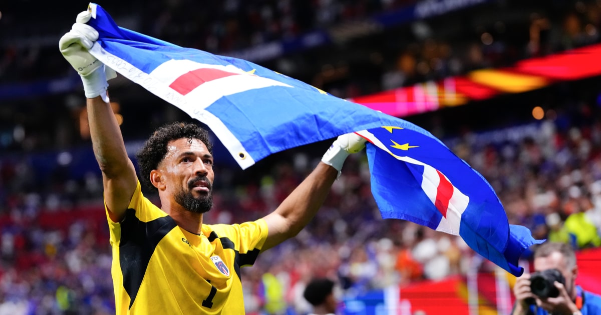 Cape Verde goalkeeper Vozinha celebrates with the national flag after the historic 0-0 draw against Spain at the 2026 World Cup
