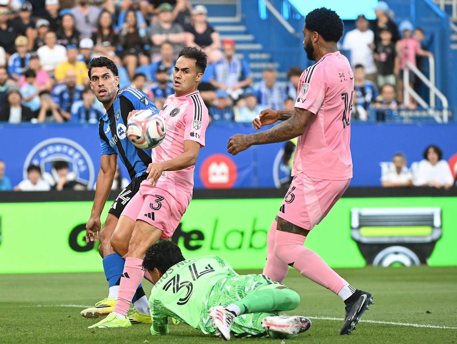 Players crowd the six-yard box as the Inter Miami goalkeeper goes to ground