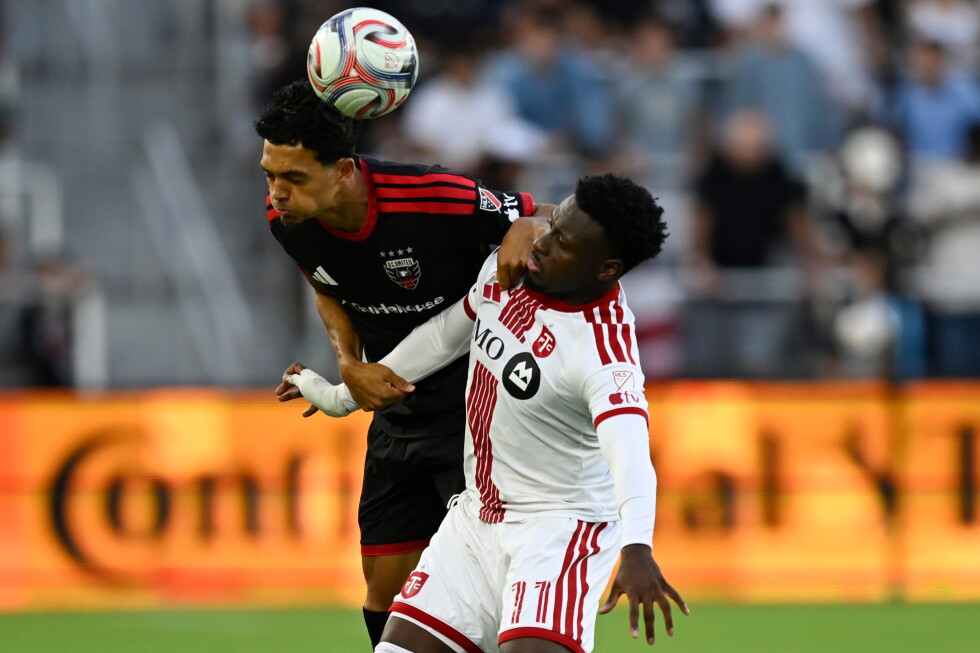 A D.C. United defender and a Toronto FC forward contest a header at Audi Field