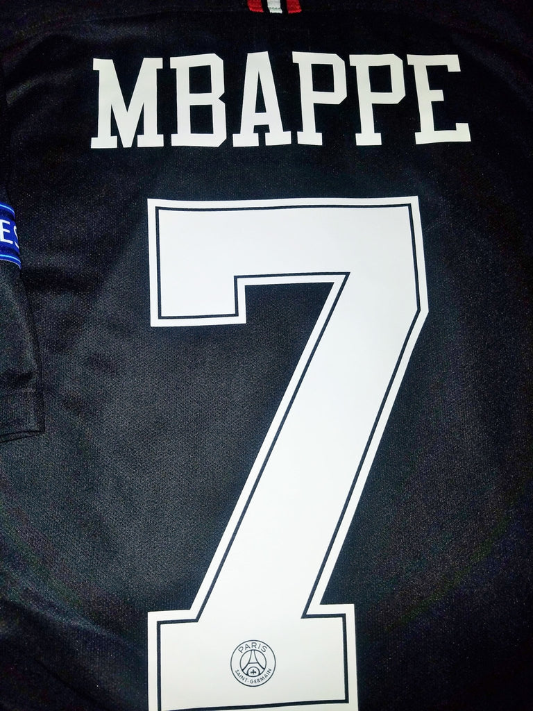 A black PSG Jordan shirt with the Jumpman logo