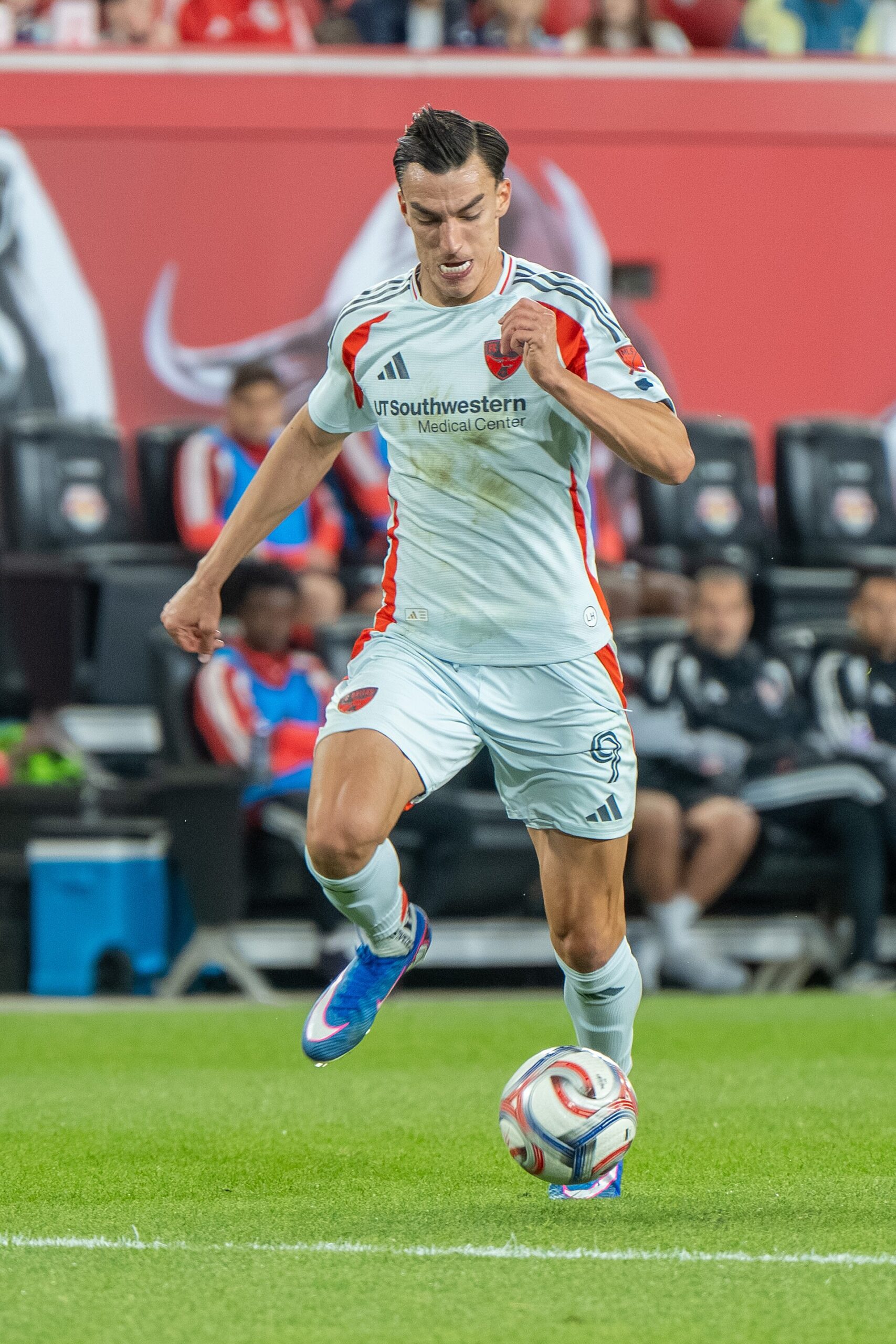 Petar Musa on the ball in FC Dallas white away kit during an MLS match in May 2026
