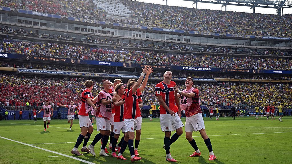 Norway players celebrate after scoring a goal against Brazil in the round of 16 at the World Cup