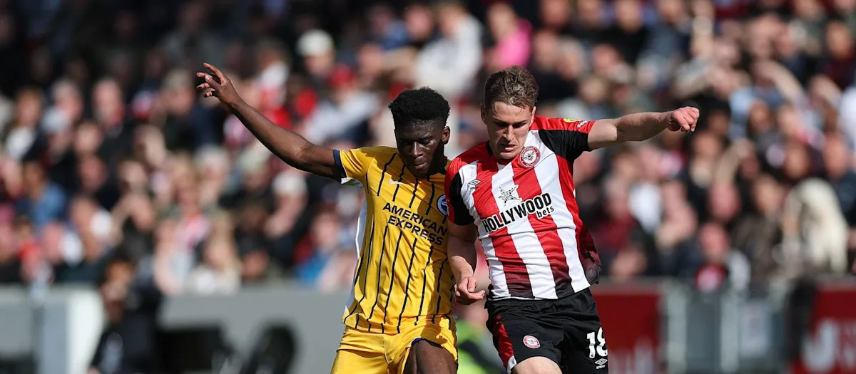 Carlos Baleba shielding the ball in Brighton's away kit against Brentford