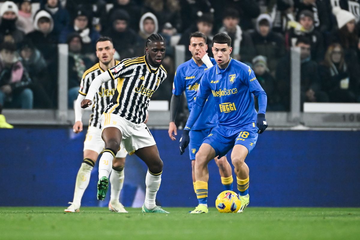 Juventus and Frosinone players compete for the ball during a Serie A match