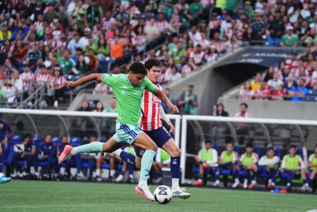 Seattle Sounders player in action against Chivas de Guadalajara at Lumen Field