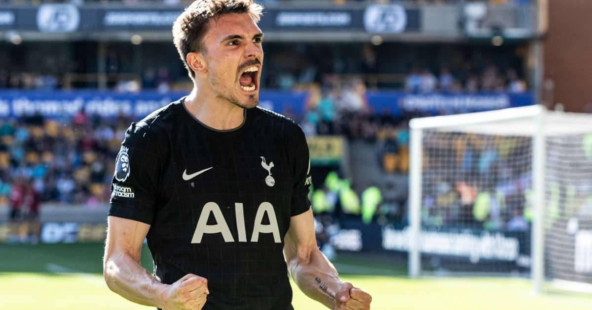 Tottenham Hotspur player in black away kit celebrates with fists clenched — Nottingham Forest vs Tottenham